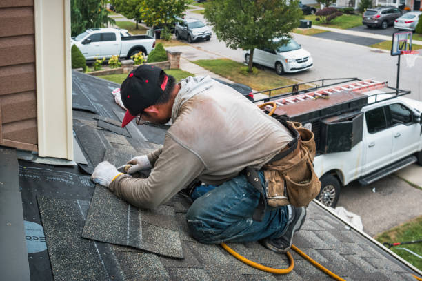 Professional Roofing technician working in Norton, MA